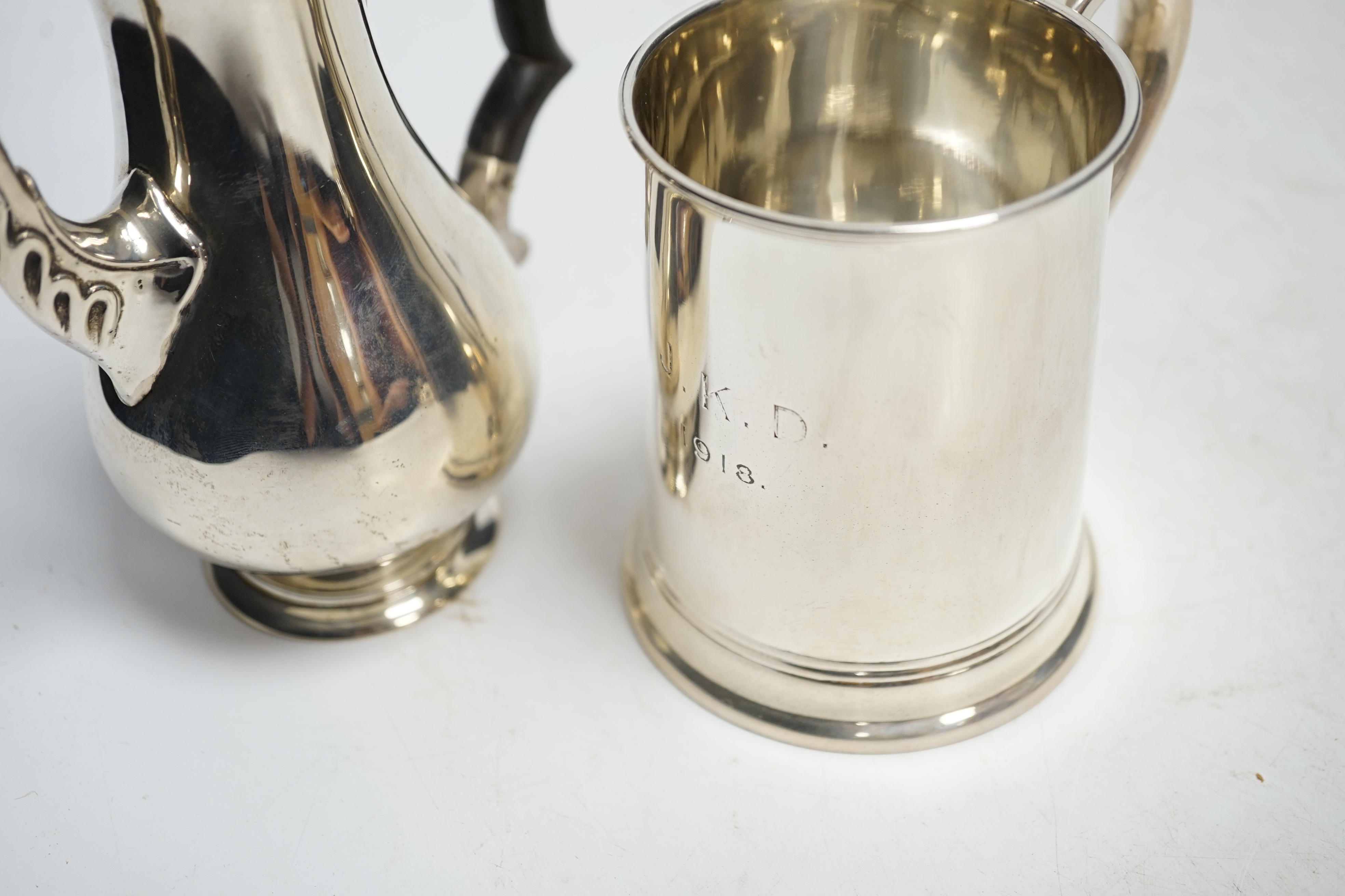 A George V silver mug, by Thomas Bradbury & Sons, 96mm and a silver bachelor's coffee pot, Chester, 1901, weighted. Condition - fair to good